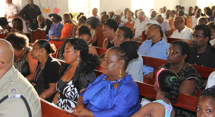Relatives of persons killed or missing as a result of the trough system among other worshippers at the memorial service on Wednesday. (IWN Photo)