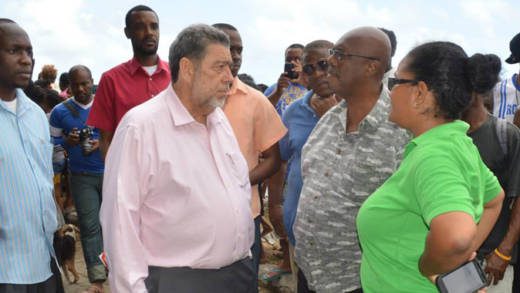 Prime Minister Dr. Ralph Gonsalves, centre, chats with Opposition Leader Arnhim Eustace and Sen. Vynnette Frederick at Rock Gutter after the tragedy on Jan. 12. (Photo: Duggie "Nose" Joseph/Facebook)
