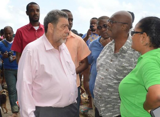 Prime Minister Dr. Ralph Gonsalves, centre, chats with Opposition Leader Arnhim Eustace and Sen. Vynnette Frederick at Rock Gutter after the tragedy on Jan. 12. (Photo: Duggie "Nose" Joseph/Facebook)