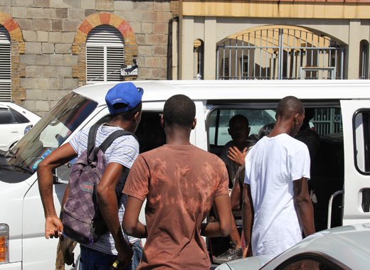 Supporters of the two minibus operators celebrate their release from police custody Thursday afternoon. (IWN photo)