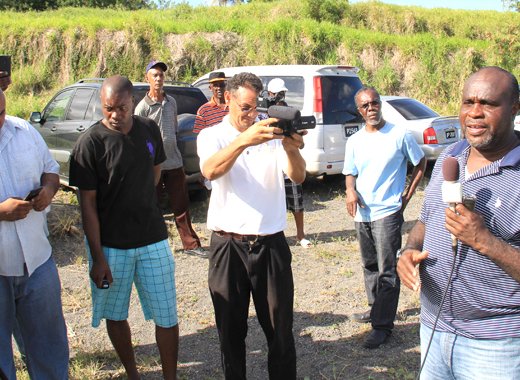 Businessman Leon "Bigger Bigs" Samuel speaks with reporters at Rabacca last week. (IWN photo)