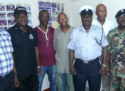 From left: Station Sergeant John Henry; Sergeant Carl Lewis; Corporals Asquith Simon, Alvin Gibson, and Vandy Bruce; Superintendent Leonard Fergus; and Assistant Superintendent Benzil Samuel.