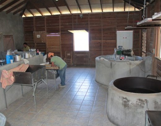 Workers use electricity and firewood to prepare cassava bread in Canaries, St. Lucia. The countrys government says renewable energy can help with value-added in the agricultural sector. Credit: Kenton X. Chance/IPS