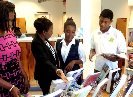 From left: Shana Brewster, Library Assistant, Pearl McMaster-Mason, senior librarian and college students.