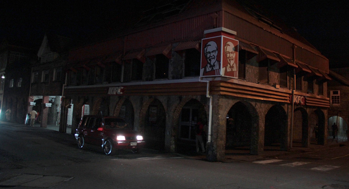 The KFC outlet in downtown Kingstown, like the two others, were closed and in darkness around 7 p.m. Monday. (IWN photo)