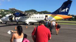 Passengers board a LIAT aircraft at St. Vincent's E.T. Joshua Airport in March 2016. (IWN file photo)