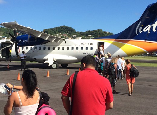 Passengers board a LIAT aircraft at St. Vincent's E.T. Joshua Airport in March 2016. (IWN file photo)