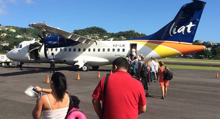 Passengers board a LIAT aircraft at St. Vincent's E.T. Joshua Airport in March 2016. (IWN file photo)