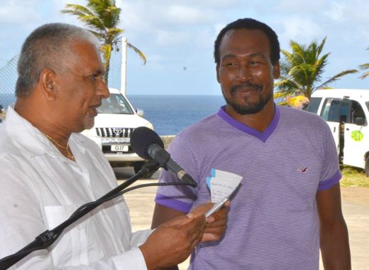 Murray Bullock of the National Lotteries Authority, commends bus driver, Urick Lavia on his driving skills. (Photo: Lance Neverson/Facebook)