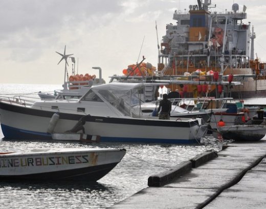 Grenadian fishermen prepare to head out to sea. They say they have been catching less fish and their livelihoods are threatened by climate change. (Photo: Desmond Brown/IPS)