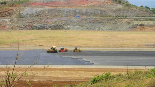 Workers are almost mid-way with the placement of the first layer of asphalt in the 2nd kilometer of the runway. (Photo: Friends of AIA/Facebook) 