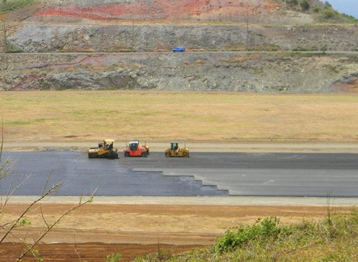 Workers are almost mid-way with the placement of the first layer of asphalt in the 2nd kilometer of the runway. (Photo: Friends of AIA/Facebook) 