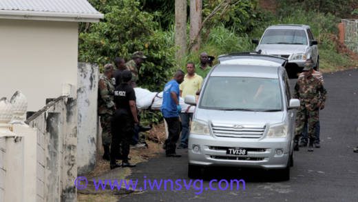 Police and funeral home staff remove Primus' body from the scene in New Montrose on Thursday. (IWN photo)