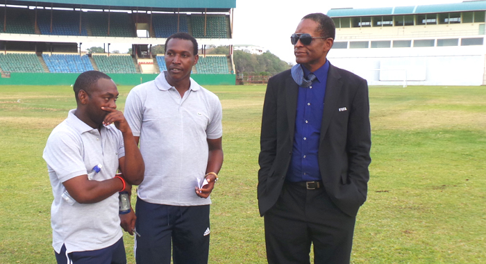 SVGFF President Venold Coombs, left. in post match discussion with coaches Coneilus Huggins and Wade "Elbir" Jackson. (Photo: E. Glenford Prescott/IWN)
