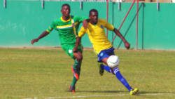 An SVG defender thwarts Dominica's attack. (Photo: E. Glenford Prescott/IWN)