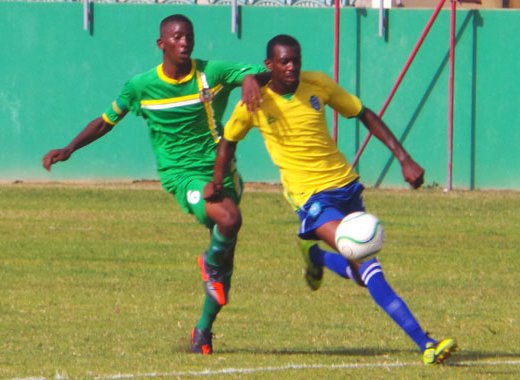 An SVG defender thwarts Dominica's attack. (Photo: E. Glenford Prescott/IWN)