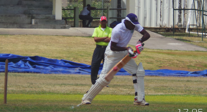 Police allrounder Kenneth Dember (60) steers to third man.