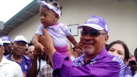 President Desi Bouterse holds a baby after casting his ballot in Monday's general elections in Suriname. (Photo: Ivan Cairo)