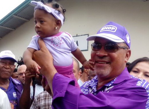 President Desi Bouterse holds a baby after casting his ballot in Monday's general elections in Suriname. (Photo: Ivan Cairo)