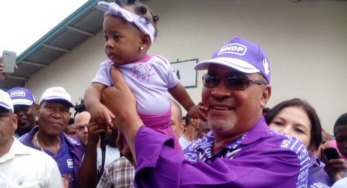 President Desi Bouterse holds a baby after casting his ballot in Monday's general elections in Suriname. (Photo: Ivan Cairo)