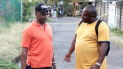 ASP Sydney James, left, and Inspector Trevor Bailey investigate a murder on Friday. They have both been transferred. (IWN photo)