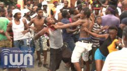 Two men, said to be residents of Barrouallie, trade blows during J'ouvert in Layou on Saturday.