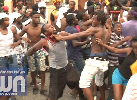 Two men, said to be residents of Barrouallie, trade blows during J'ouvert in Layou on Saturday.