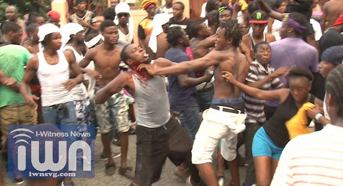 Two men, said to be residents of Barrouallie, trade blows during J'ouvert in Layou on Saturday.