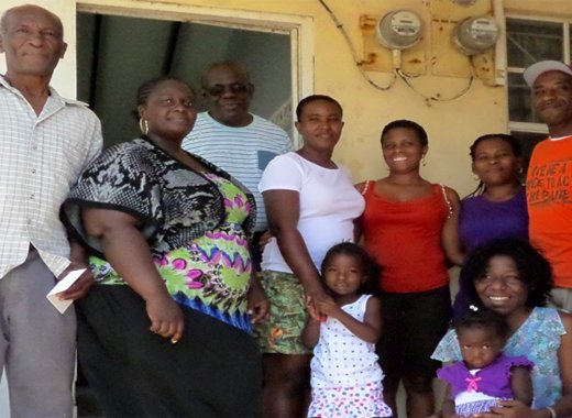 Rev. Chiefton Charles, third left, and Brother Vincent Benjamin, furthest right, of the Church of the Nazarene and recipients of the donation. 