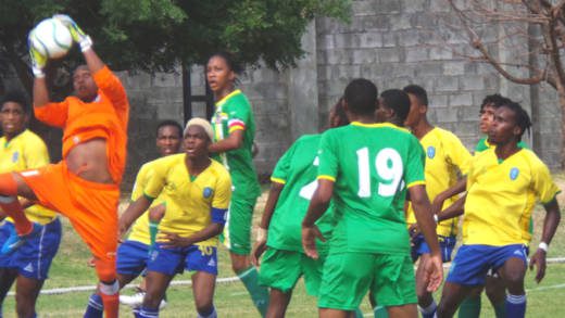 Dominica 'keeper Elijah Toulon goes high to avert danger. (Photo: E. Glenford Prescott/IWN)