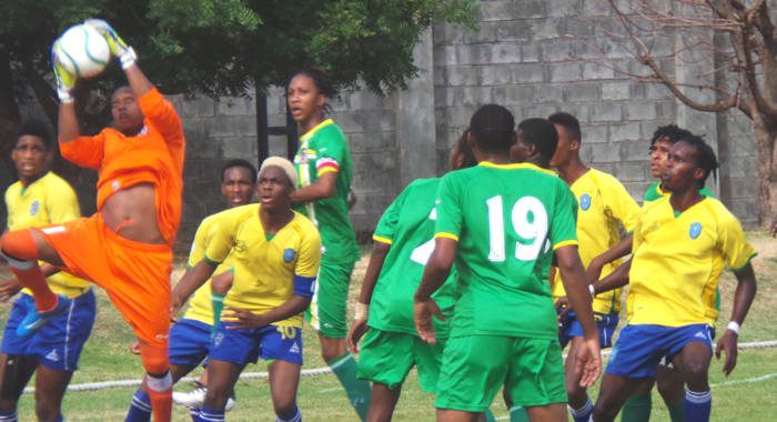 Dominica 'keeper Elijah Toulon goes high to avert danger. (Photo: E. Glenford Prescott/IWN)