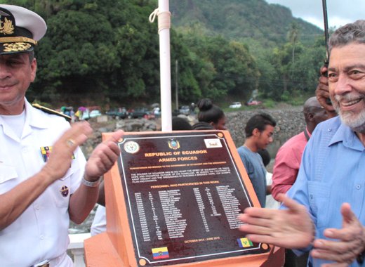 Prime Minister of SVG Ralph Gonsalves, right, and Major Manuel Querembas of the Ecuadorian Army applaud after unveiling a plaque at Hope Bridge. (Photo: Zavique Morris-Chance/IWN)