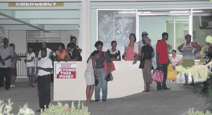 Persons Gather Outside The Accident And Emergency Ward Of The Milton Cato Memorial Hospital, Where Primus Was Taken After The Stabbing. (Iwn Photo)