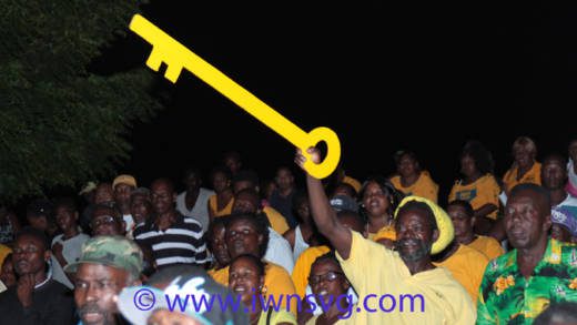 A man holds a key, the symbol f the NDP, at a party rally in June 2015. The party will hold its annual convention today. (IWN photo)