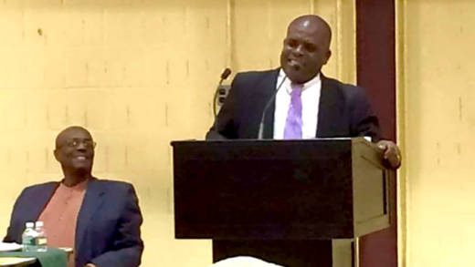 MP for North Leeward Roland "Patel" Matthews addresses the town hall meeting in New York as party Leader Arnhim Eustace looks on. (Photo: Facebook)