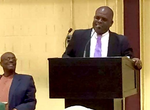 MP for North Leeward Roland "Patel" Matthews addresses the town hall meeting in New York as party Leader Arnhim Eustace looks on. (Photo: Facebook)