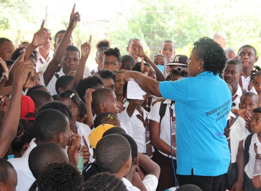 A police officer interacts with students during the anti-crime tour of secondary school.