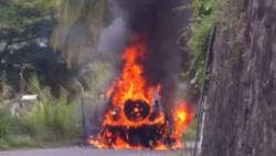 The vehicle engulfed in flames in Layou. 
