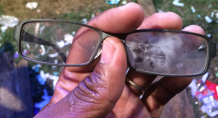 Executive Editor of I-Witness News, Kenton X. Chance's glasses broken when they were hit by pyrotechnics during the Soca Monarch competition. (IWN photo)