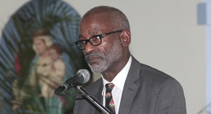 Neurosurgeon Dr. Phillip St. Louis speaking at the funeral of Nicole Sylvester. (IWN photo)