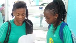 Coach Andrea Davis-Latchman, left, and Shantel Williams go through some last minute details at ET. Joshua Airport. (Photo: E. Glenford Prescott)