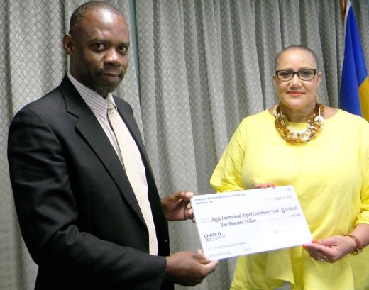 Dr. Rudolph Matthias of IADC receives the US$10,000  cheque from Annett Stowe of FAIA . (Photo: FAIA/Facebook)