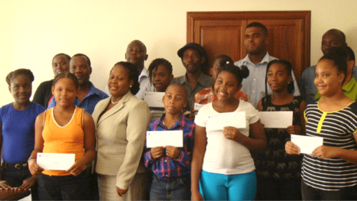 Scholarship and bursary recipients and their parents pose for a photo.