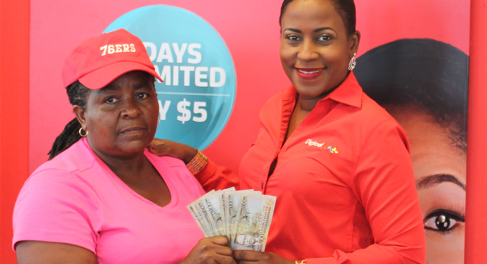 Commercial Manager Dionne Emtage handsover 1000 to winner Marlene Ash