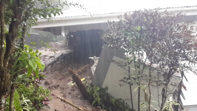 A retired policeman and his wife were injured when a landslide crashed into the back of this dwelling house at Castle Comfort. (Photo: Dominica News Online)