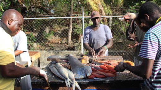 Fishers process fish during Fisherman's Day celebrations in St. Vincent in 2014. (IWN photo)