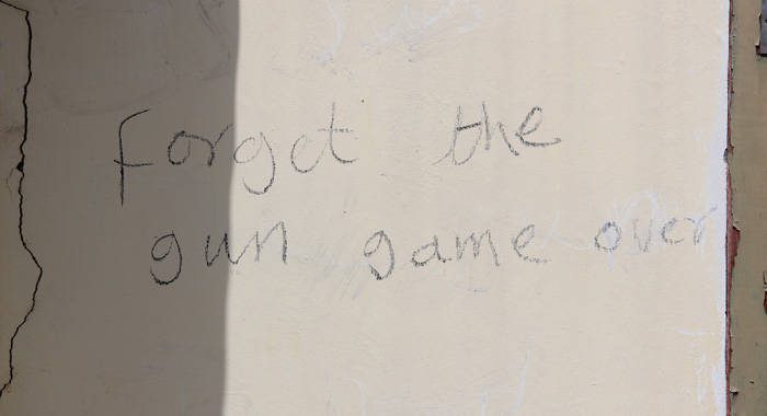 One of the messages written on Hugh Stewart's house in Collins, after he turned over to police a gun he found on his property. (IWN photo)