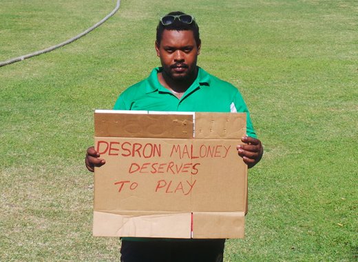 Rodger Gibson on Tuesday protests the exclusion of opener Desron Maloney. (Photo: E. Glenford Prescott)