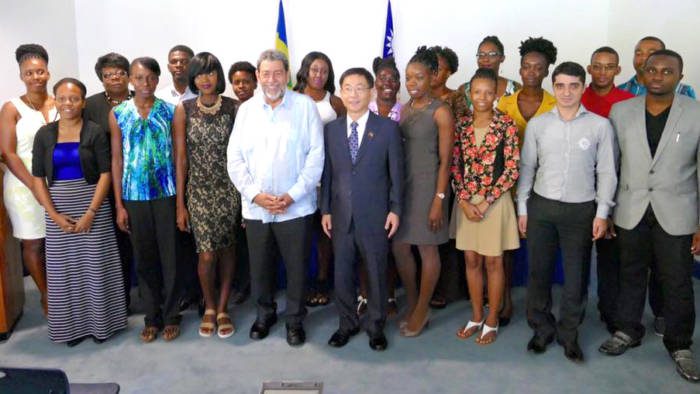 The scholarship recipients pose with Prime Minister Ralph Gonsalves, Ambassador Baushuan Ger, and Minister of Education Girlyn Miguel. (Photo: Jamali Jack).