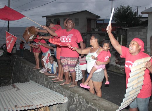 Protesters beat pieces of metal and shout in Sandy Bay on Sunday. (IWN photo)